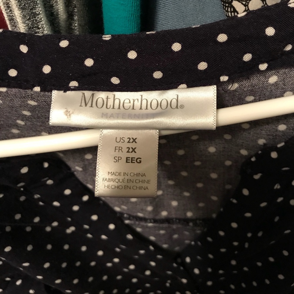 Cute navy polka dot maternity top!